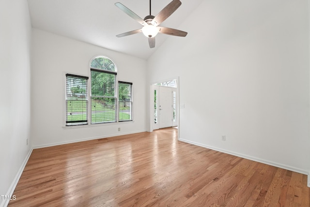 111 Catherwood Pl, Cary, NC 27518 - empty room with ceiling fan, light wood-style floors, high vaulted ceiling, and baseboards