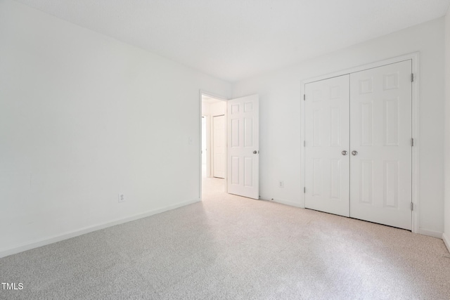 111 Catherwood Pl, Cary, NC 27518 - unfurnished bedroom featuring baseboards, a closet, and carpet