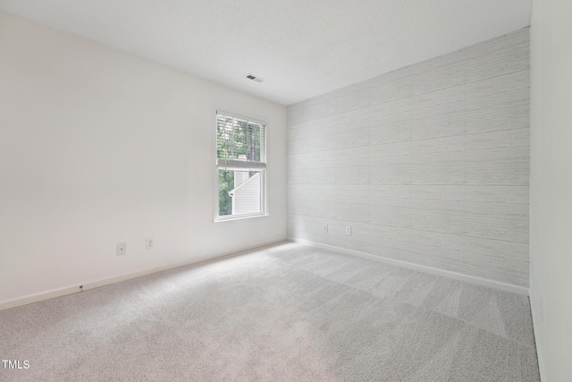 111 Catherwood Pl, Cary, NC 27518 - carpeted empty room featuring baseboards and wood walls