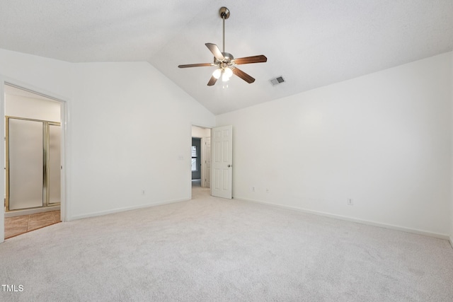 111 Catherwood Pl, Cary, NC 27518 - unfurnished bedroom with light carpet, baseboards, ensuite bath, and high vaulted ceiling