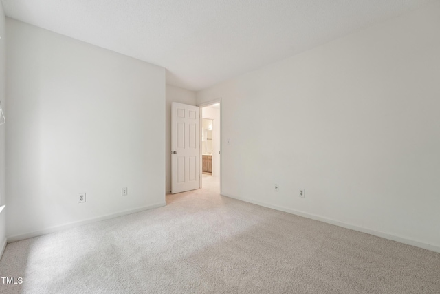 111 Catherwood Pl, Cary, NC 27518 - spare room featuring light carpet and baseboards