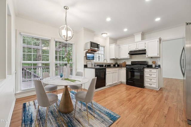 111 Catherwood Pl, Cary, NC 27518 - dining area with a chandelier, crown molding, light wood-style floors, and recessed lighting