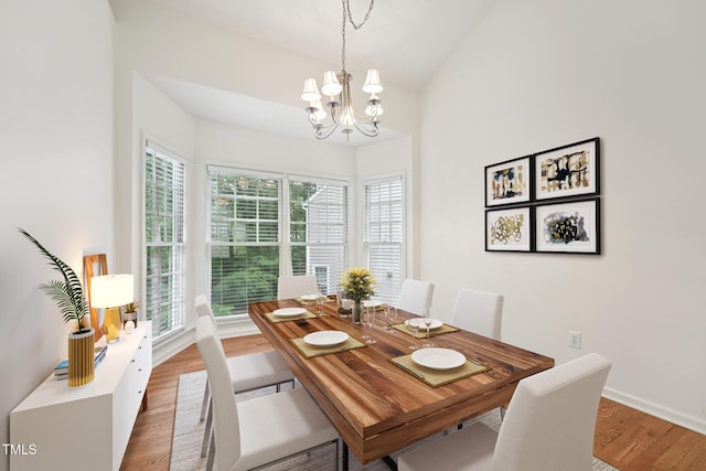 111 Catherwood Pl, Cary, NC 27518 - dining room featuring a chandelier, wood finished floors, and baseboards