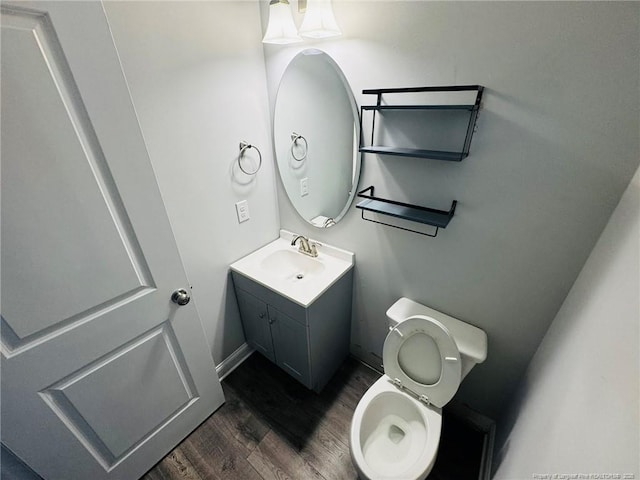 4179 Overhills Rd, Spring Lake, NC 28390 - bathroom featuring wood finished floors, toilet, and vanity