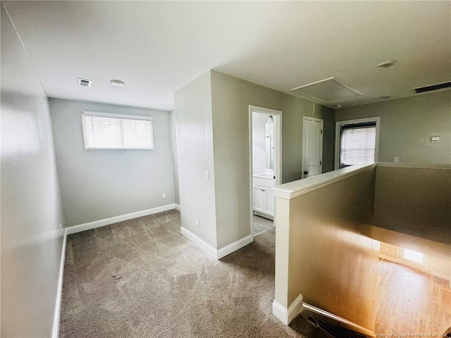 4179 Overhills Rd, Spring Lake, NC 28390 - hall with attic access, carpet flooring, and baseboards