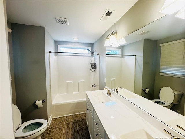 4179 Overhills Rd, Spring Lake, NC 28390 - full bath featuring toilet, tub / shower combination, double vanity, and healthy amount of natural light