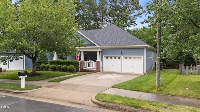 2313 Filigree Ct, Raleigh, NC 27614 - view of front of home featuring a garage, a front lawn, roof with shingles, driveway, and covered porch