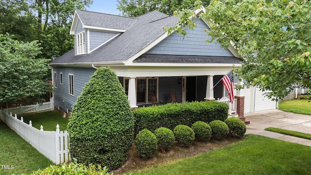 2313 Filigree Ct, Raleigh, NC 27614 - view of front facade featuring a shingled roof, a porch, and driveway