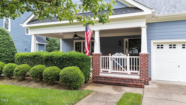 2313 Filigree Ct, Raleigh, NC 27614 - view of exterior entry with covered porch, roof with shingles, brick siding, an attached garage, and ceiling fan