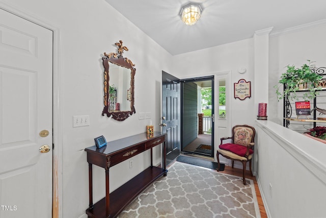 2313 Filigree Ct, Raleigh, NC 27614 - entryway with wood finished floors and crown molding