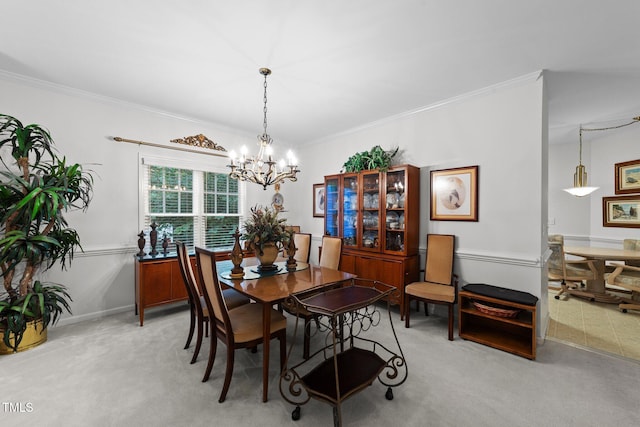 2313 Filigree Ct, Raleigh, NC 27614 - dining room featuring a chandelier, ornamental molding, and light colored carpet