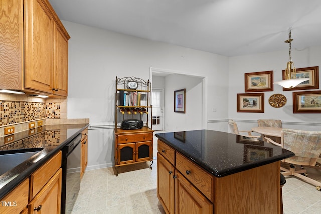 2313 Filigree Ct, Raleigh, NC 27614 - kitchen featuring dishwasher, backsplash, dark stone counters, brown cabinets, and a kitchen island