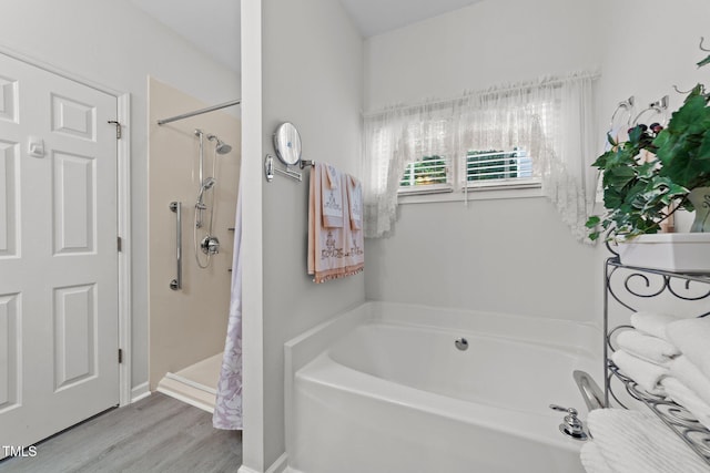 2313 Filigree Ct, Raleigh, NC 27614 - bathroom featuring a bath, a shower stall, and wood finished floors