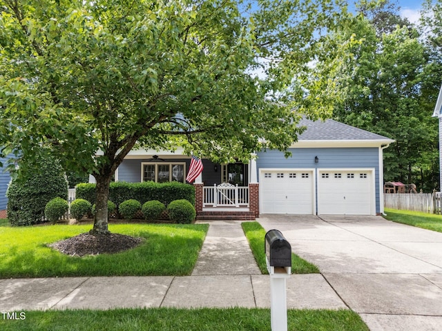 2313 Filigree Ct, Raleigh, NC 27614 - view of property hidden behind natural elements featuring an attached garage, concrete driveway, covered porch, a shingled roof, and ceiling fan
