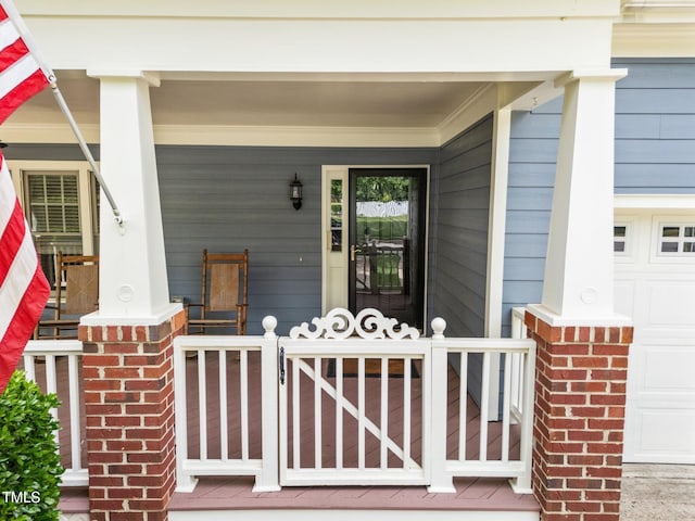 2313 Filigree Ct, Raleigh, NC 27614 - doorway to property featuring covered porch and a garage