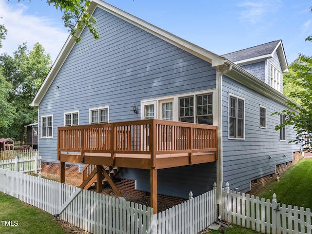 2313 Filigree Ct, Raleigh, NC 27614 - rear view of house with a deck, a fenced backyard, crawl space, and roof with shingles