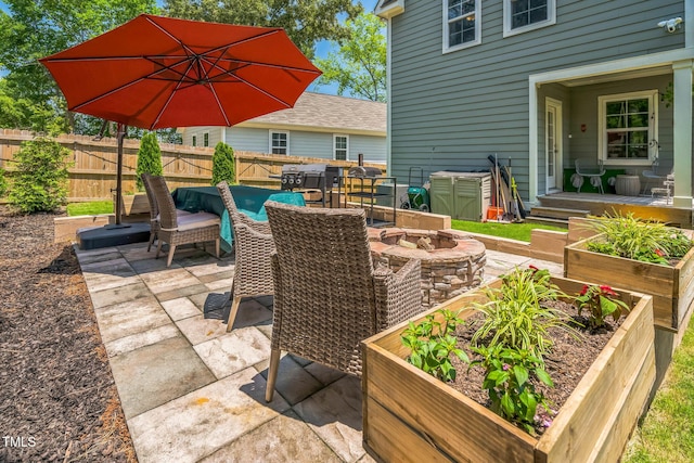 647 N Hardee St, Durham, NC 27703 - view of patio / terrace with an outdoor fire pit and a garden