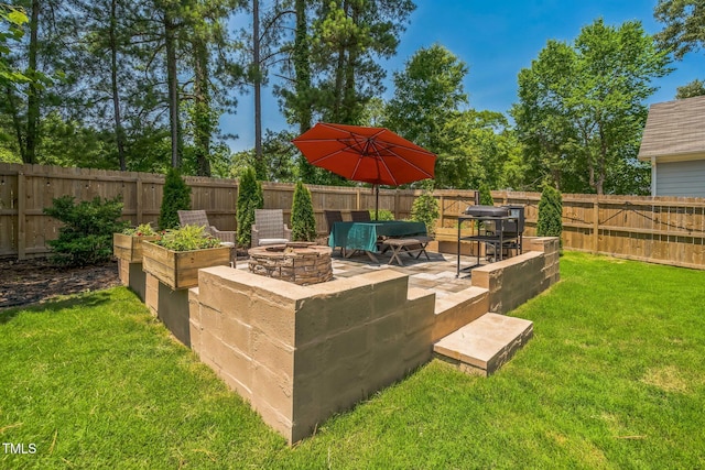 647 N Hardee St, Durham, NC 27703 - view of yard featuring an outdoor fire pit and a patio area