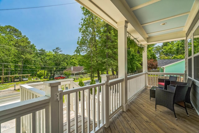 647 N Hardee St, Durham, NC 27703 - wooden porch featuring view of scattered trees