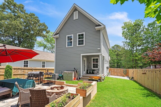 647 N Hardee St, Durham, NC 27703 - rear view of property with a garden