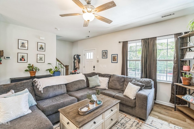 647 N Hardee St, Durham, NC 27703 - living area featuring light wood-style flooring, healthy amount of natural light, ceiling fan, and baseboards