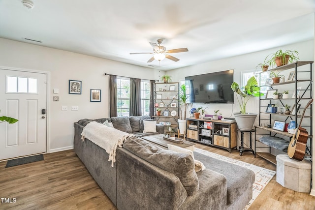 647 N Hardee St, Durham, NC 27703 - living area featuring wood finished floors and ceiling fan