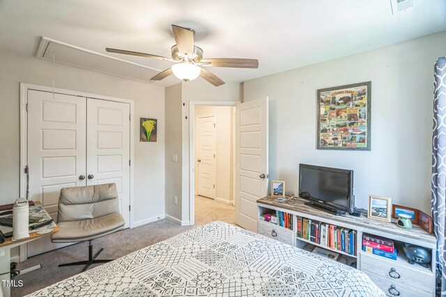 647 N Hardee St, Durham, NC 27703 - carpeted bedroom with attic access, a closet, ceiling fan, and baseboards
