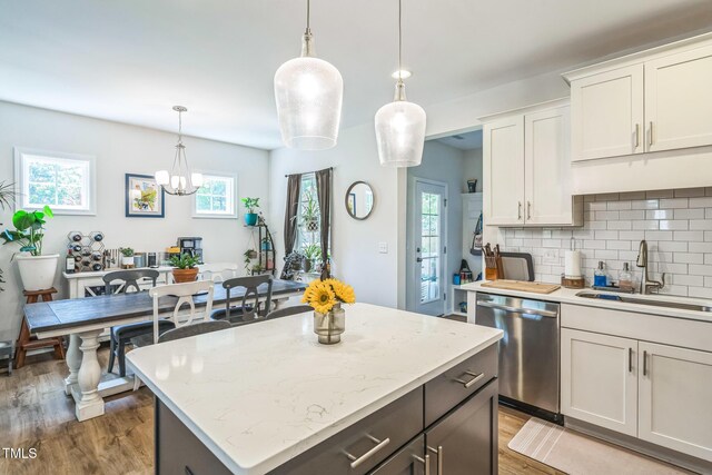 647 N Hardee St, Durham, NC 27703 - kitchen featuring dishwasher, light wood finished floors, a sink, and plenty of natural light