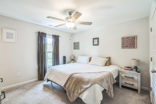 647 N Hardee St, Durham, NC 27703 - bedroom with light colored carpet, baseboards, and a ceiling fan