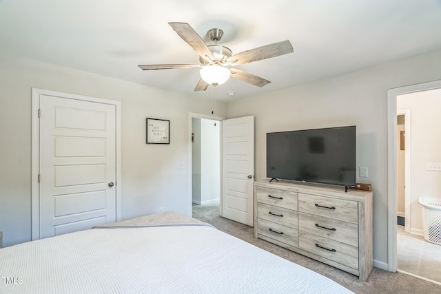 647 N Hardee St, Durham, NC 27703 - unfurnished bedroom with light carpet, baseboards, and a ceiling fan