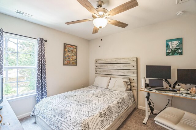 647 N Hardee St, Durham, NC 27703 - bedroom with carpet floors, baseboards, and multiple windows