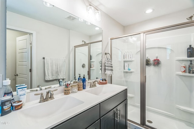 647 N Hardee St, Durham, NC 27703 - full bath featuring a stall shower, double vanity, and recessed lighting