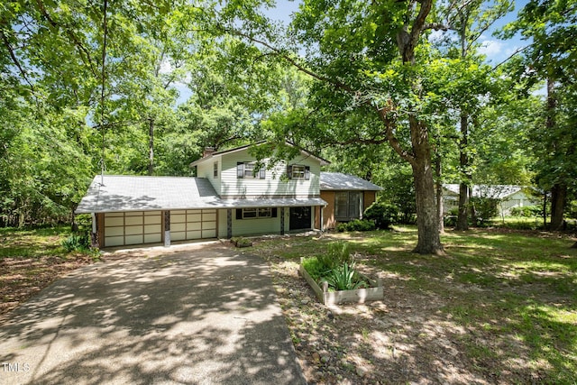 134 Chateau Rd, Durham, NC 27704 - view of front facade featuring driveway and an attached garage