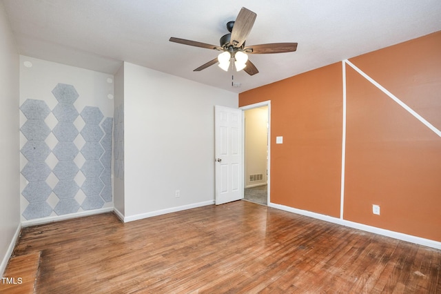 134 Chateau Rd, Durham, NC 27704 - unfurnished room with a ceiling fan, wood finished floors, and baseboards