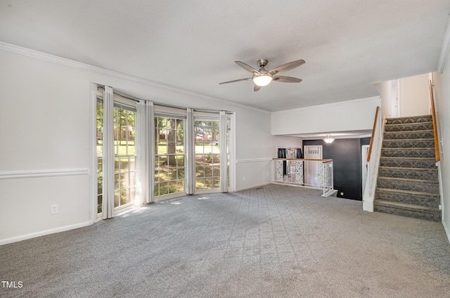 134 Chateau Rd, Durham, NC 27704 - unfurnished living room with a ceiling fan, crown molding, carpet flooring, stairs, and baseboards