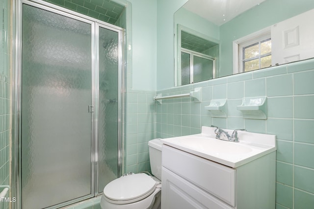 134 Chateau Rd, Durham, NC 27704 - full bathroom with tile walls, toilet, vanity, and a shower stall