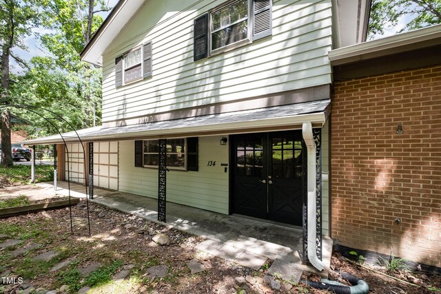 134 Chateau Rd, Durham, NC 27704 - entrance to property with brick siding and french doors