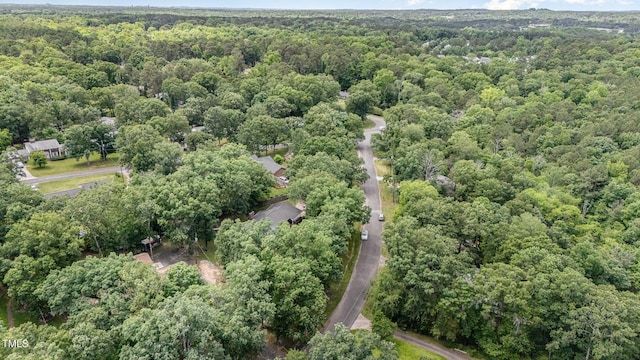 134 Chateau Rd, Durham, NC 27704 - aerial view of property and surrounding area featuring a heavily wooded area