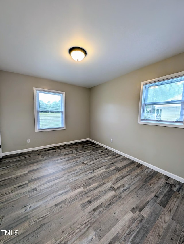 1602 Fairground Rd, Dunn, NC 28334 - spare room featuring healthy amount of natural light, wood finished floors, and baseboards