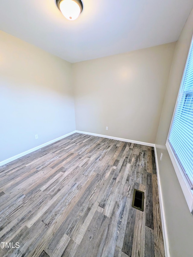 1602 Fairground Rd, Dunn, NC 28334 - unfurnished room with wood finished floors and baseboards