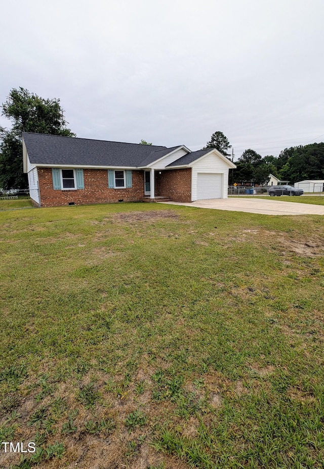 1602 Fairground Rd, Dunn, NC 28334 - ranch-style house with driveway, brick siding, a garage, and a front yard