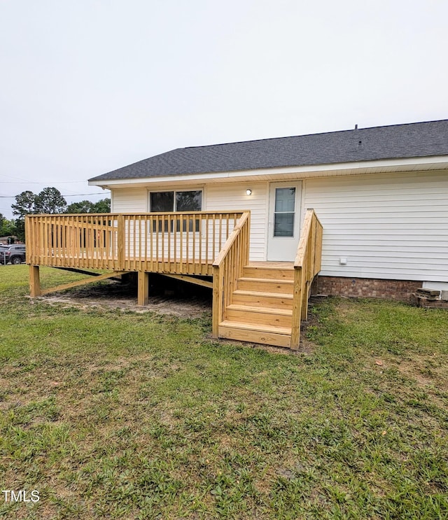 1602 Fairground Rd, Dunn, NC 28334 - back of house featuring a wooden deck, a yard, and roof with shingles