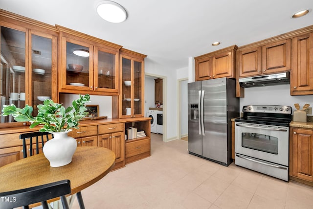 117 Summerlin Dr, Chapel Hill, NC 27514 - kitchen with appliances with stainless steel finishes, under cabinet range hood, brown cabinets, glass insert cabinets, and recessed lighting