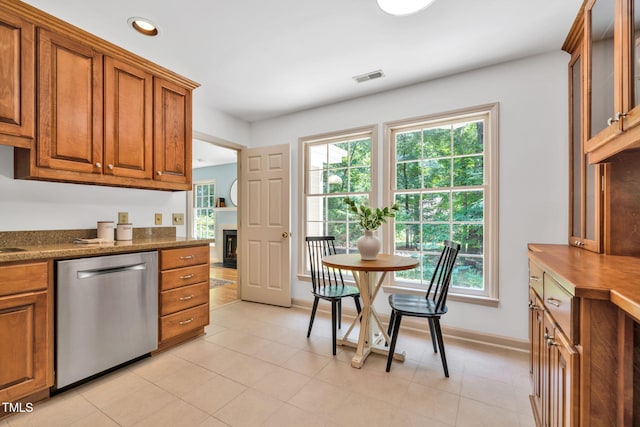 117 Summerlin Dr, Chapel Hill, NC 27514 - kitchen featuring stainless steel dishwasher, brown cabinets, recessed lighting, and glass insert cabinets