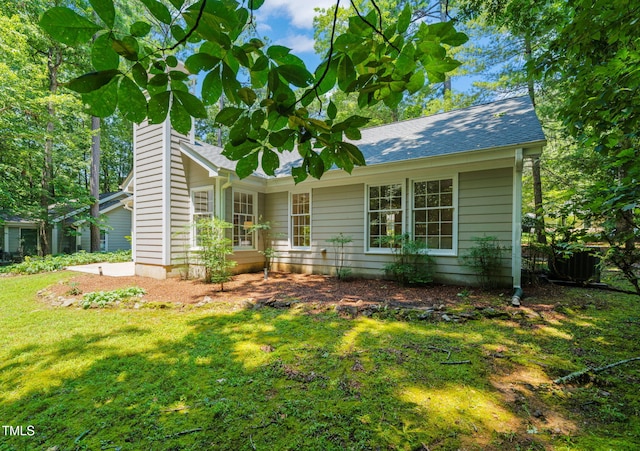 117 Summerlin Dr, Chapel Hill, NC 27514 - view of front facade featuring a front yard, a chimney, and roof with shingles