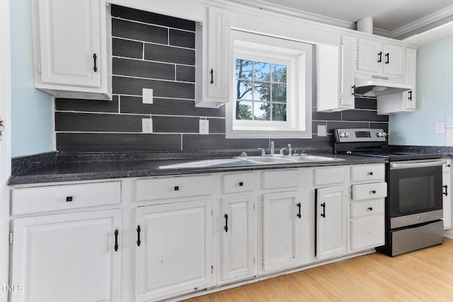 403 S Webb St, Selma, NC 27576 - kitchen featuring stainless steel electric range oven, under cabinet range hood, white cabinets, backsplash, and crown molding