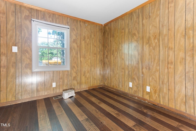 403 S Webb St, Selma, NC 27576 - empty room with dark wood-style flooring, wooden walls, and baseboards