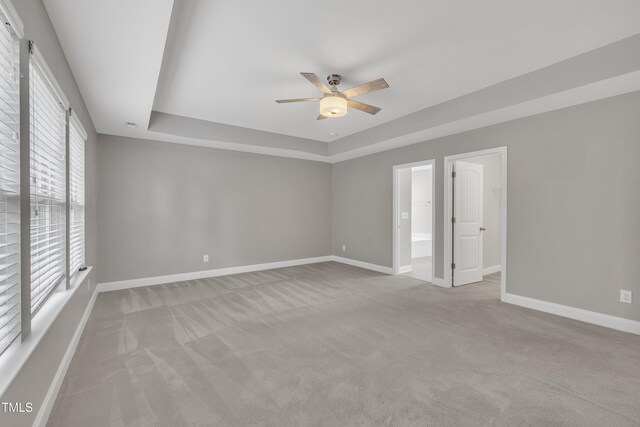 2018 Morehead Hill Ct, Durham, NC 27703 - carpeted spare room with a raised ceiling, ceiling fan, and baseboards