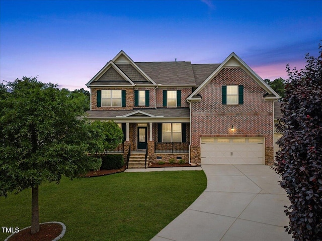 1704 Fawn Chase Ct, Wake Forest, NC 27587 - craftsman-style house with an attached garage, concrete driveway, a yard, brick siding, and covered porch