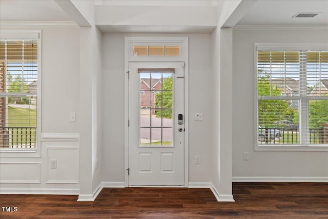 1704 Fawn Chase Ct, Wake Forest, NC 27587 - foyer entrance featuring plenty of natural light, dark wood finished floors, ornamental molding, and baseboards